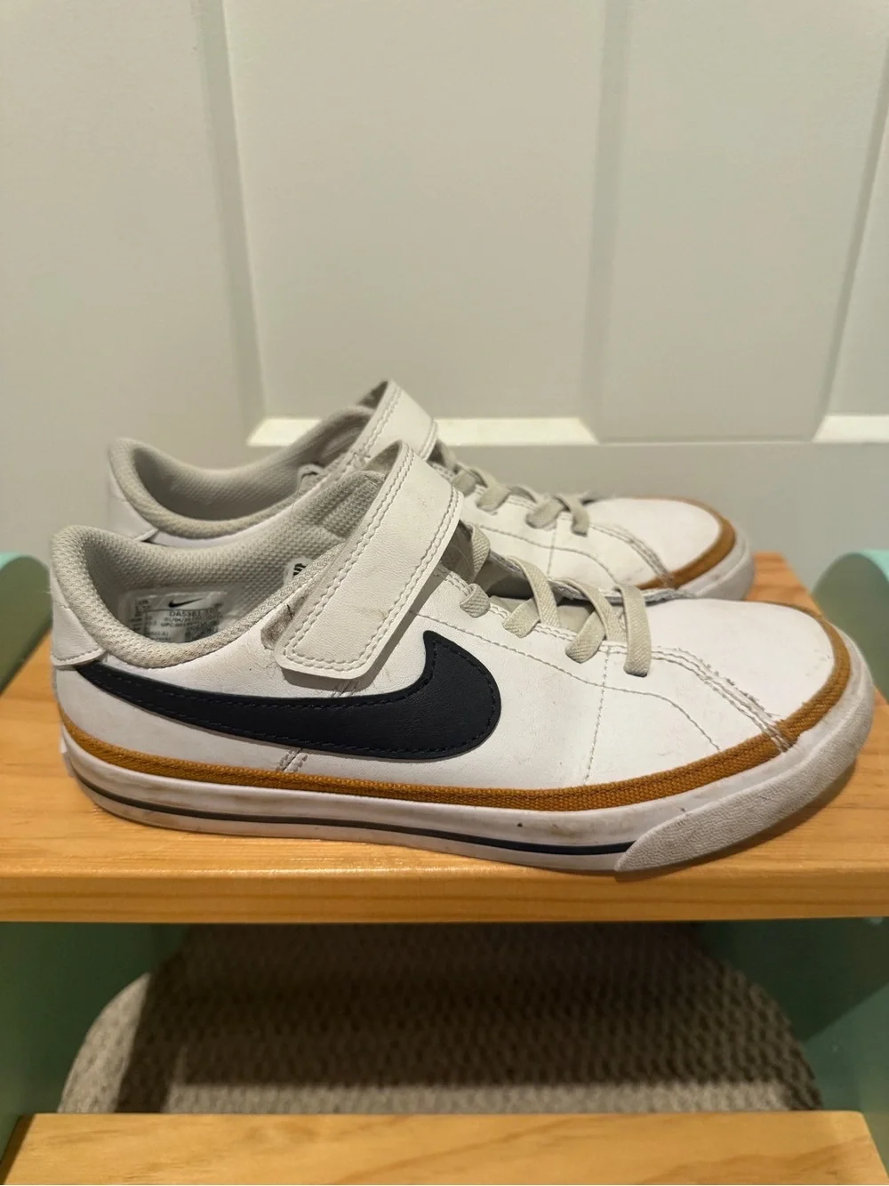 Nike Kids White Sneakers with Black Swoosh and Tan Stripe